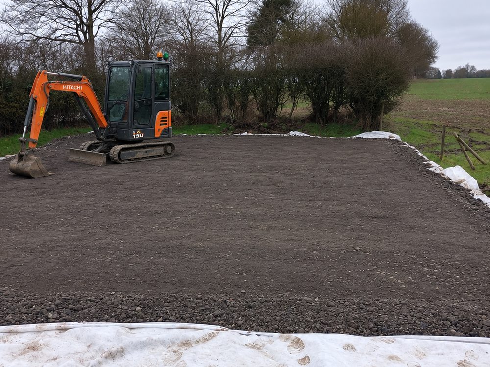 Hardcore base laid and levelled with a mini digger on site